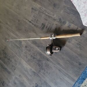 Ice fishing rod w/ zebco xrl37 reel.wooden handle